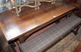 A 17th century style oak refectory table and a pair of benches 168cm length