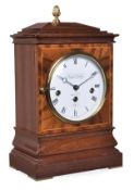 A line inlaid mahogany quarter chiming mantel clock, retailed by Knight and Gibbons, London, late