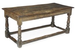 An oak refectory table, 17th century and later, rectangular plank top, baluster legs and