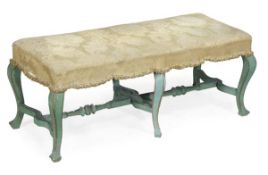 A green painted wood and upholstered stool, 19th century, rectangular padded seat, six shaped
