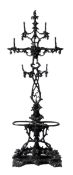 A Victorian cast iron hall stand, circa 1870, cast as a stylised tree, with pierced foliate