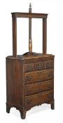 A George III oak linen or book press, circa 1780, press above three short and three long drawers on