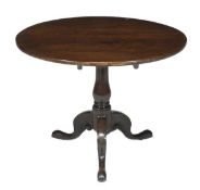 A George III mahogany tripod table, circa 1760, circular top, turned stem, triple pierced and