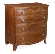A Regency mahogany bowfront chest of drawers, circa 1815, four long drawers, outswept bracket feet,