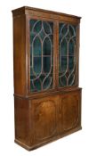 A George III mahogany cabinet bookcase, circa 1800, moulded and kingwood crossbanded cornice, a