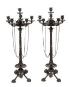 A pair of French patinated bronze six light candelabra in the "Pompeiian" taste, circa 1875, each