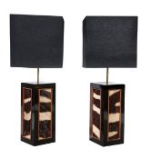 A pair of ebonised and zebra skin inset lamps, of recent manufacture, black rectangular shades,