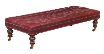 A mahogany and buttoned red leather upholstered long stool, in William IV style, 19th century and