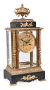 A French gilt and patinated brass four glass mantel clock, retailed by J. Hartmann, Berlin, late