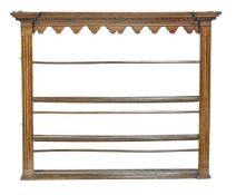 A George III hanging plate rack, late 18th/early 19th century, dentil cornice, arcaded frieze,