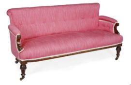 A Victorian walnut and upholstered sofa, circa 1870, overscrolling rectangular back and arms with