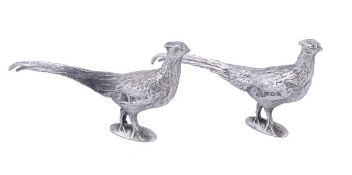 Two silver small models of pheasants, maker`s mark `SMD`, London 12, standing on oval bases, 7cm (2