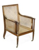 A mahogany bergere armchair in Regency style, late 19th/early 20th century, caned rectangular