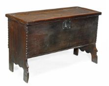 A Charles I oak coffer, circa 1620, panelled hinged, intregal trestle feet, 62cm high, 102cm wide, 4