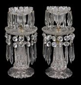 A pair of cut glass and brass mounted lustre candlesticks, late 19th / early 20th century, the