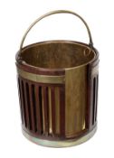 A George III mahogany and brass bound plate bucket, circa 1790, of pierced form, with brass liner