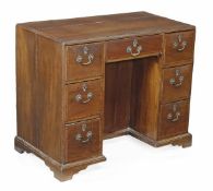 A George III mahogany and satinwood crossbanded kneehole desk, circa 1780, rectangular top,