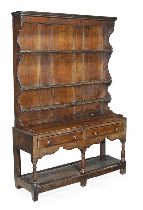 An oak dresser, second half 18th century, moulded cornice above three open shelves, base with two
