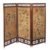 An Aesthetic rosewood framed and crewel work inset three fold screen, circa 1890 and incorporating 1