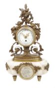 A French Louis XVI style gilt brass and white marble mantel timepiece Unsigned, circa 1900 The