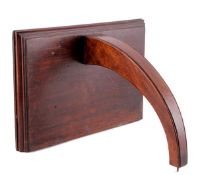 A mahogany clock bracket Early 19th century The rectangular platform with complex mouldings above