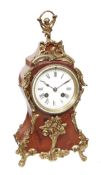 A French Louis XV style brass mounted mantel clock Unsigned, late 19th century and later The eight-