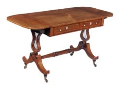 A Regency rosewood and kingwood crossbanded sofa table, circa 1815, rectangular top with D-shaped