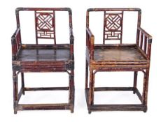 A set of four Chinese lacquered hardwood and bamboo armchairs, 19th century, all with latticework