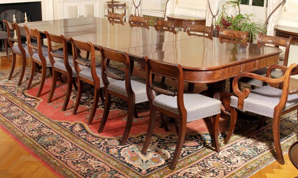 A George IV mahogany twin pillar extending dining table, circa 1825, rectangular top with rounded