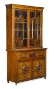 A Victorian oak and brass mounted secretaire bookcase stamped MAPLE & CO LTD, circa 1880, moulded