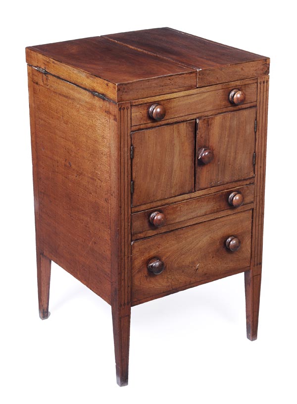 A George III mahogany washstand, circa 1800, hinged top opening to apertures for a wash bowl and