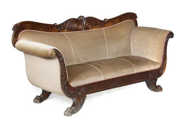 A William IV mahogany framed sofa, circa 1835, possibly Irish, serpentine back centred by twin
