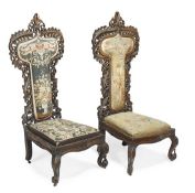 A matched pair of Ango-Indian carved hardwood prie dieu chairs, circa 1870, elaborately carved and