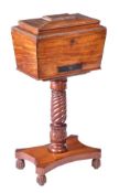A Regency mahogany teapoy, circa 1815, cavetto moulded and gadrooned top, opening to three fitted