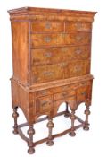 A walnut chest on stand, early 18th century and later elements, cornice with cushion moulded