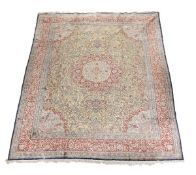 A woven wool and part silk carpet, approximately 360 x 276cm