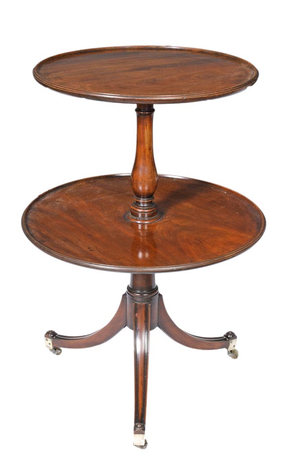 A George IV mahogany two tier dumb waiter, circa 1825, circular tiers, baluster stem, three