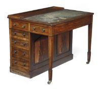 A Regency mahogany writing desk, circa 1815, rectangular top, an arrangement of six drawers to each
