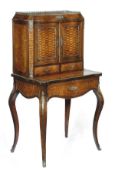 A French tulipwood, kingwood and gilt metal mounted bonheur du jour, circa 1870, serpentine