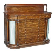 A William IV mahogany breakfront side cabinet, circa 1835, raised shelf with three quarter gallery,