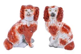 A pair of Staffordshire groups of the British lion mauling Napoleon III, sparsely coloured, 24cm