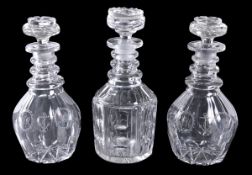 A pair of cut-glass and engraved commemorative decanters and stoppers, decorated with roundels with