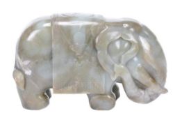 A Chinese jade elephant supporting, on its back, a saddle blanket decorated with the Wish Granting