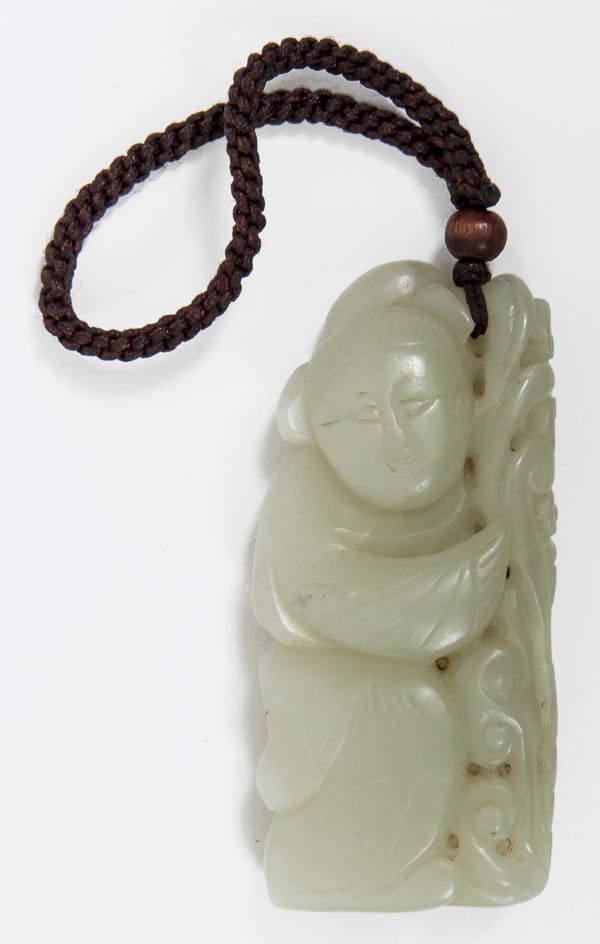 A Chinese pale celadon jade carving on the form of a boy holding a branch of lingzhi fungi, 7.5cm