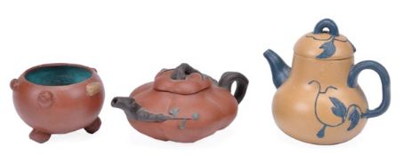 Three Yixing wares comprising a melon form teapot and cover with black handle, spout and knop, the