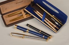 A Dupont roller ball pen, a Miyota fountain pen, a Waterman fountain pen, a pair of Parker pens in