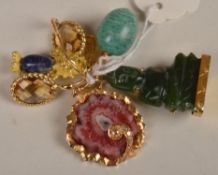 A small collection of jewellery including a pair of citrine earrings, a nephrite buddha pendant, an