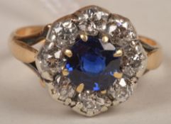 A Victorian sapphire and diamond cluster ring, the sapphire with a surround of eight rub over set