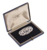 An Art Deco diamond plaque brooch, circa 1930, collet set to the centre with an old brilliant-cut