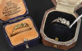 A diamond ring, the three stone mount claw set with two brilliant-cut diamonds (one stone missing),